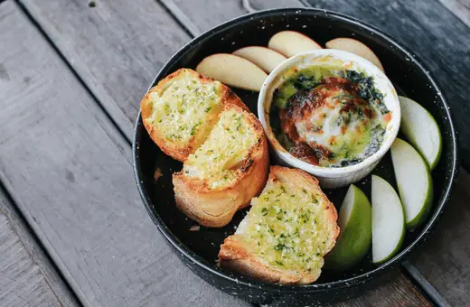garlic bread is a classic side dish that accompanies tomato basil pie perfectly. Try making garlic bread from scratch using fresh garlic and herbs for an extra special treat