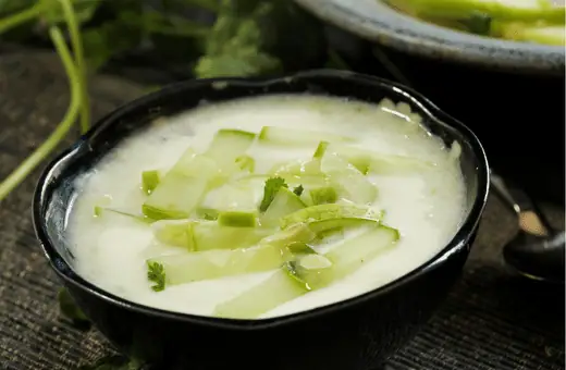 Raita is a yogurt-based sauce that is commonly served with biryani. It helps to cool down the dish's spiciness and adds a refreshing crunch. You can make raita by mixing yogurt with chopped cucumbers, tomatoes, onions, and mint leaves.