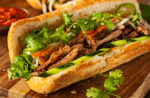 Spicy Tuna Banh Mi features canned tuna mixed with mayonnaise, Sriracha sauce, and diced cucumber. 