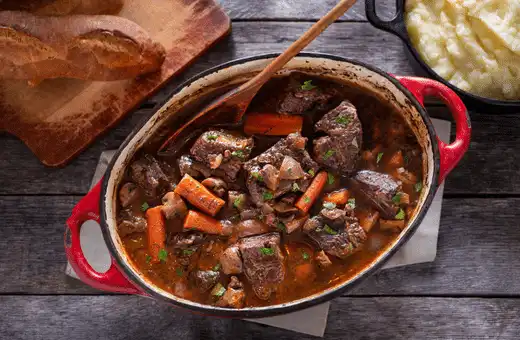 Beef Bourguignon is a classic French stew that features tender beef, mushrooms and red wine that's slowly cooked until it reaches melt-in-the-mouth perfection.