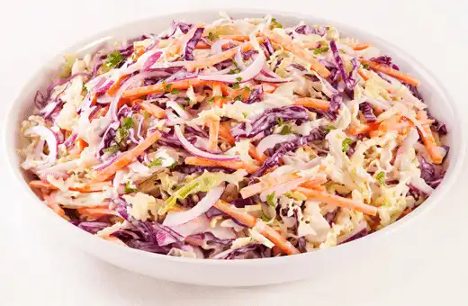 Crisp, creamy mayonnaise-based slaw is always a great addition to any meal, and it's especially delicious when served alongside chicken tenders.