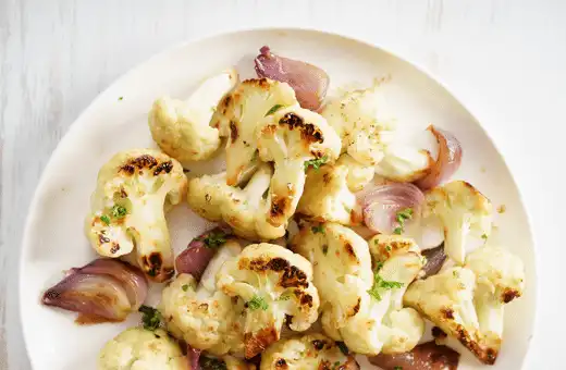 Roasting cauliflower in the oven brings out its natural sweetness and creates a delicious side dish. 