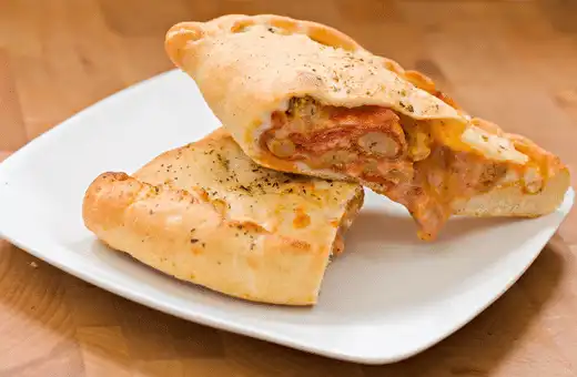 Spinach-Artichoke Calzones are a tasty and healthy side dish that goes well perfectly with chicken thighs.
