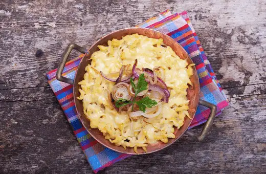 A classic combination is shredded Gruyere or Emmental cheese melted over hot spaetzle topped with fried onions and fresh parsley.