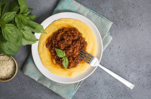 Polenta is the perfect side to serve with a plate of steamed mussels. It is a delicious Italian dish made from cornmeal and cooked slowly until it is creamy and soft. 