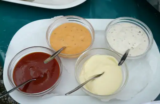 Mustard BBQ sauce along with ketchup, ranch dressing and Mayo