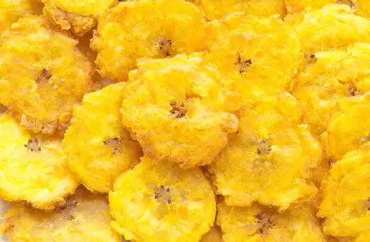 Tostones are a type of fried plantain chip that goes excellent with ceviche