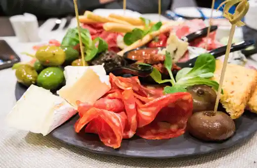 An antipasti platter is another great way to start off any meal that features lobster tails as its main course. 