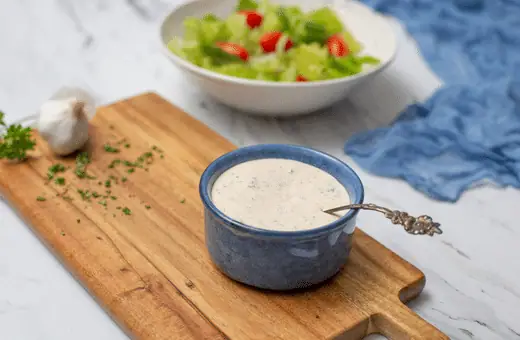 This tangy and creamy dressing is the perfect topping for shrimp and grits. It's made from buttermilk, mayonnaise, garlic, herbs, and spices.