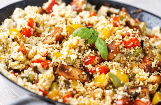 Treat yourself to this light yet flavorful couscous-based salad, which features juicy corn kernels plus bright bell peppers for added sweetness - topping it off with some cooked shrimp makes this Mediterranean-inspired combo even more delicious!