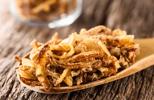 fried onion strings are good side to serve with hamburger steak