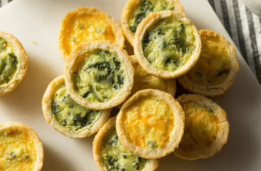 mini quiches are good side dish to go with your cheese ball