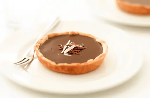 Steak dinners are strong romances that can benefit from something light for dessert. This salted caramel chocolate tart fits the bill perfectly. 