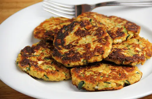 Transform zucchini into delicious fritters by shredding it first, then mixing it with eggs, flour, and herbs of your choice, plus some parmesan cheese, before frying them in hot oil until golden brown perfection is achieved - yum!
